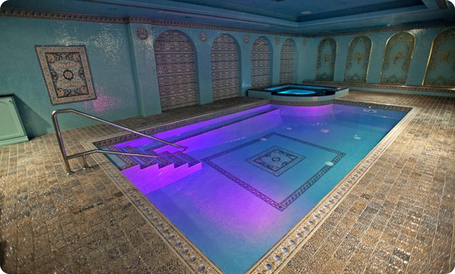 Ornate indoor pool with tiled design