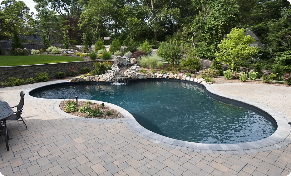 Curved pool beside patio area