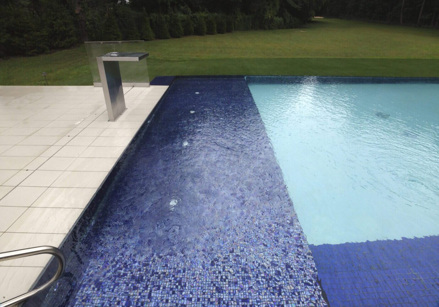 Blue tiles and clear pool water