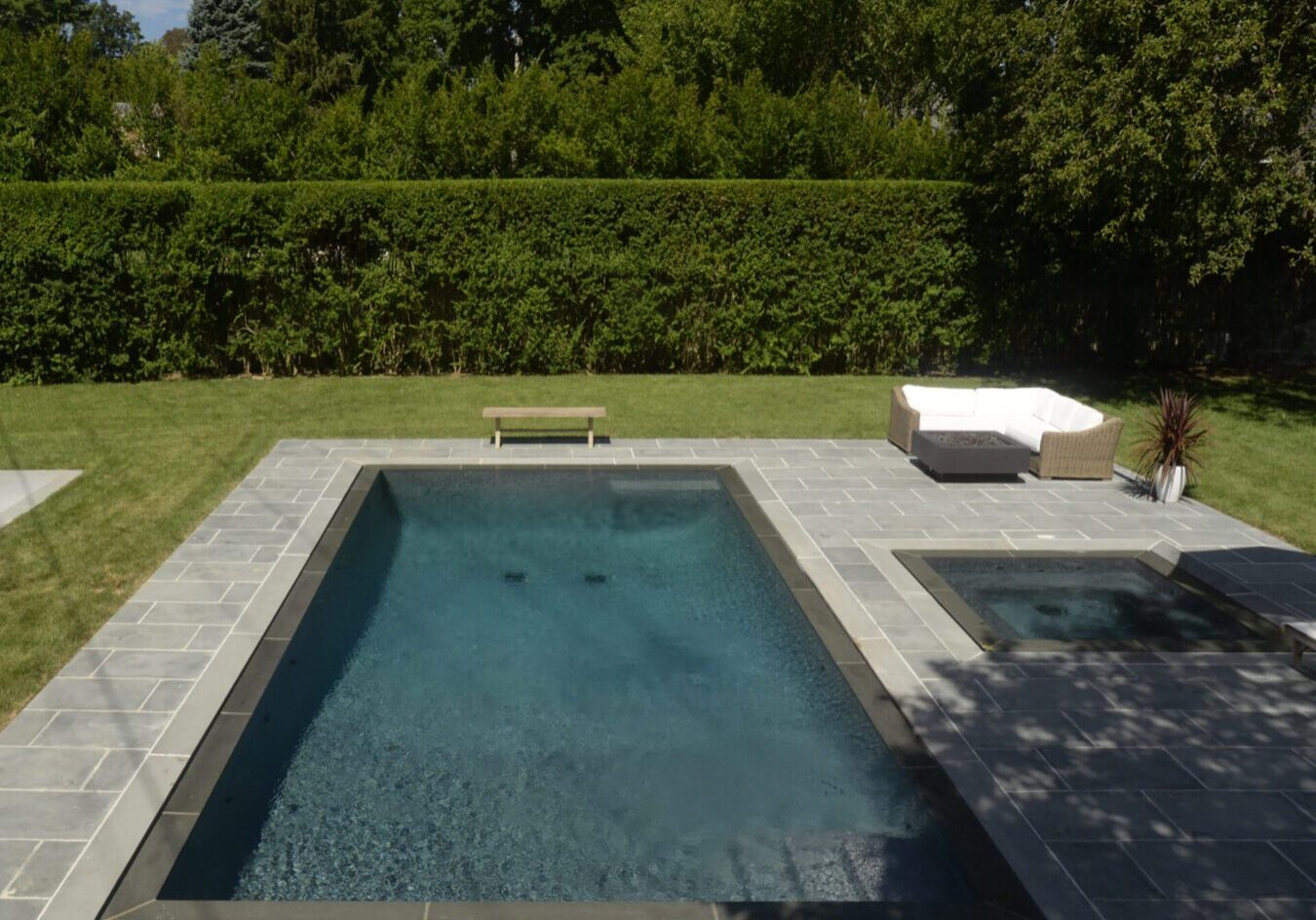 Modern pool with adjacent hot tub