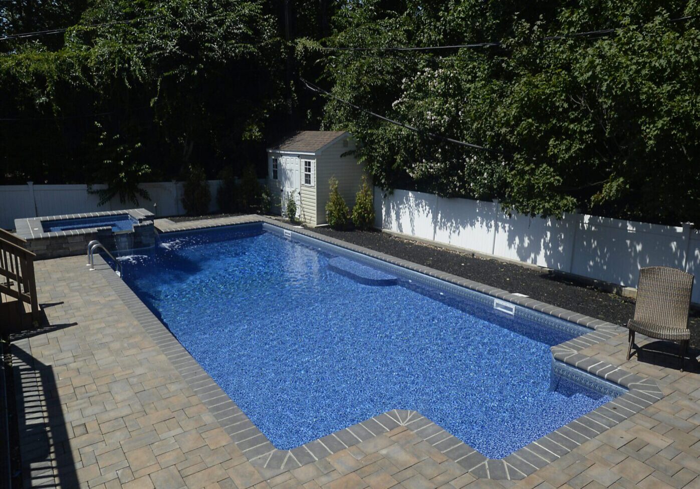 Rectangular swimming pool and greenery