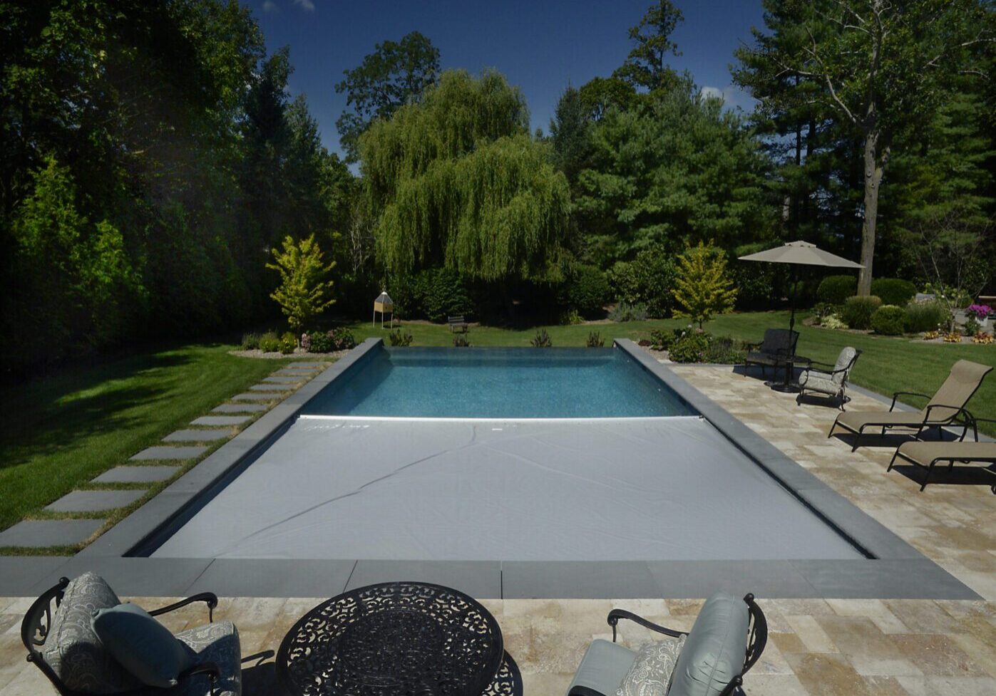 Tranquil garden pool and seating area