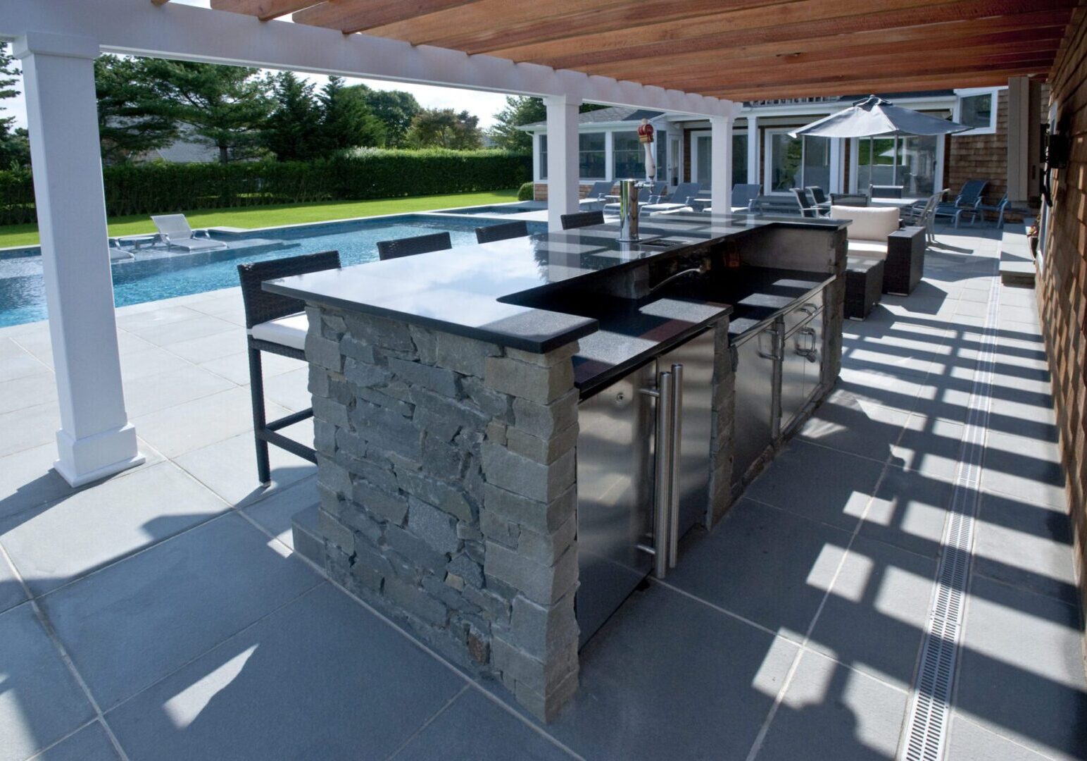 Stone bar beside swimming pool