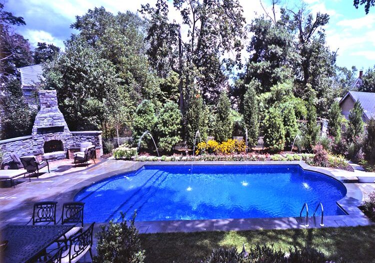 Outdoor pool and stone fireplace