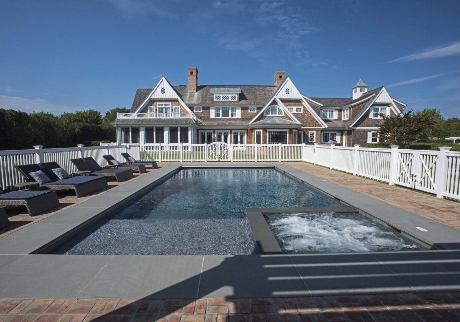 Large estate featuring swimming pool and deck